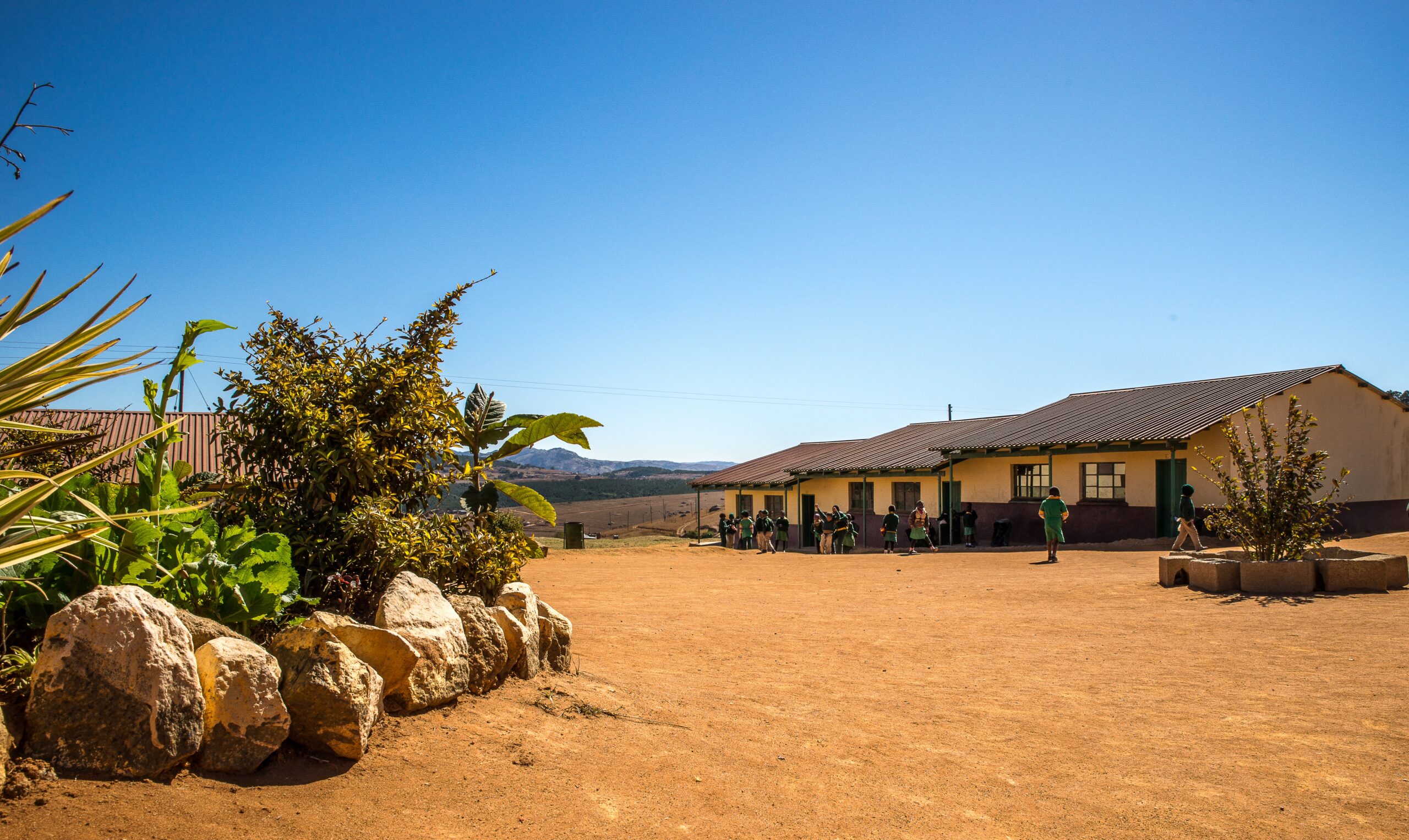 Wide angle shot of houses built on a dry field